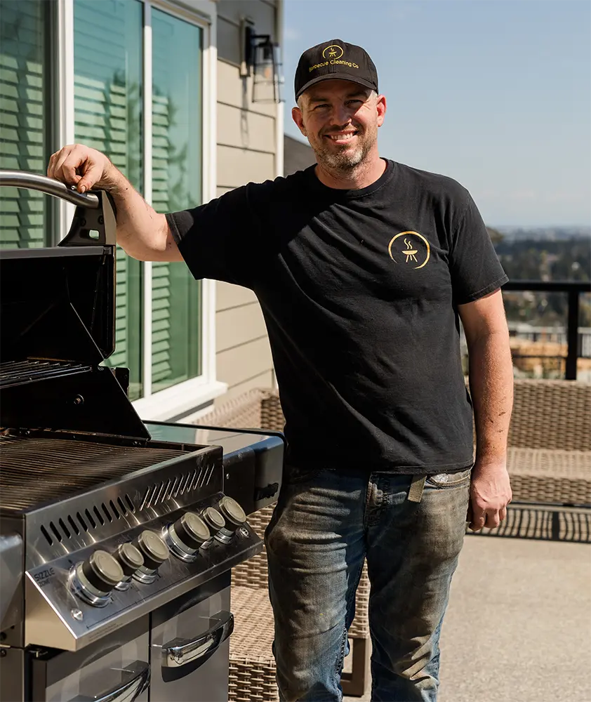 Bbq cleaning co owner standing next to a big bbq